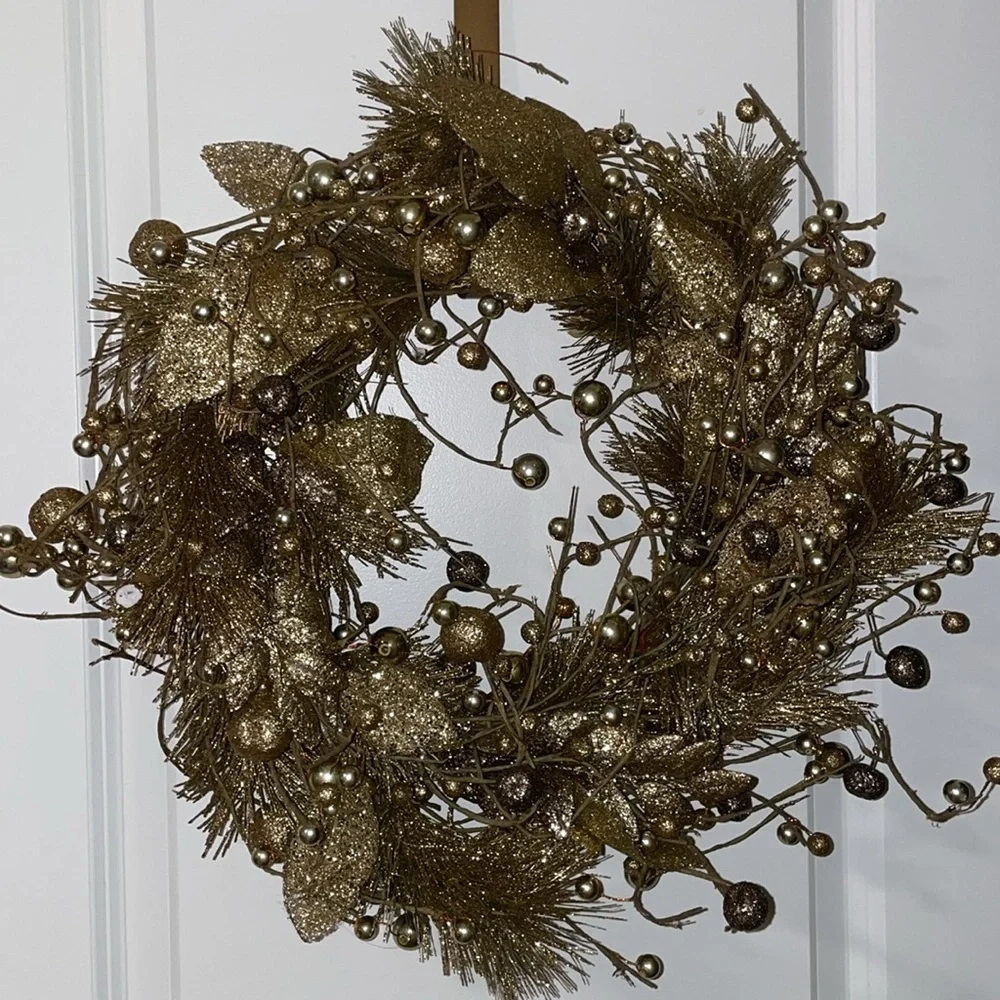 Golden decorative handing wreath